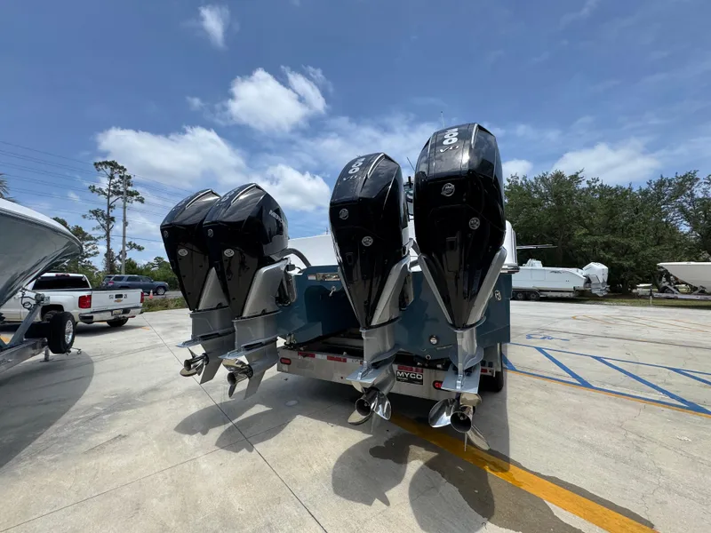 Slide: The Image of 2026 Invincible 36 Catamaran with four powerful outboard engines on a trailer. - 14