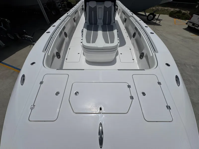 Slide: The Image of 2026 Invincible 36 Catamaran deck view with seating and storage compartments. - 17