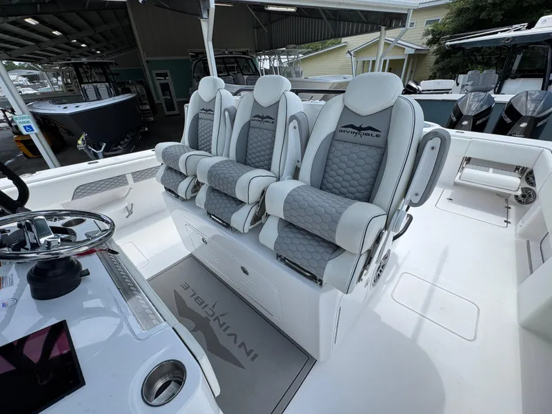 Slide: The Image of 2026 Invincible 36 Catamaran with luxurious seating and modern helm design. - 26