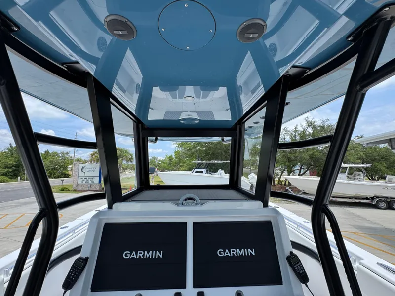 Slide: The Image of 2026 Invincible 36 Catamaran cockpit with dual Garmin displays and sleek design. - 30