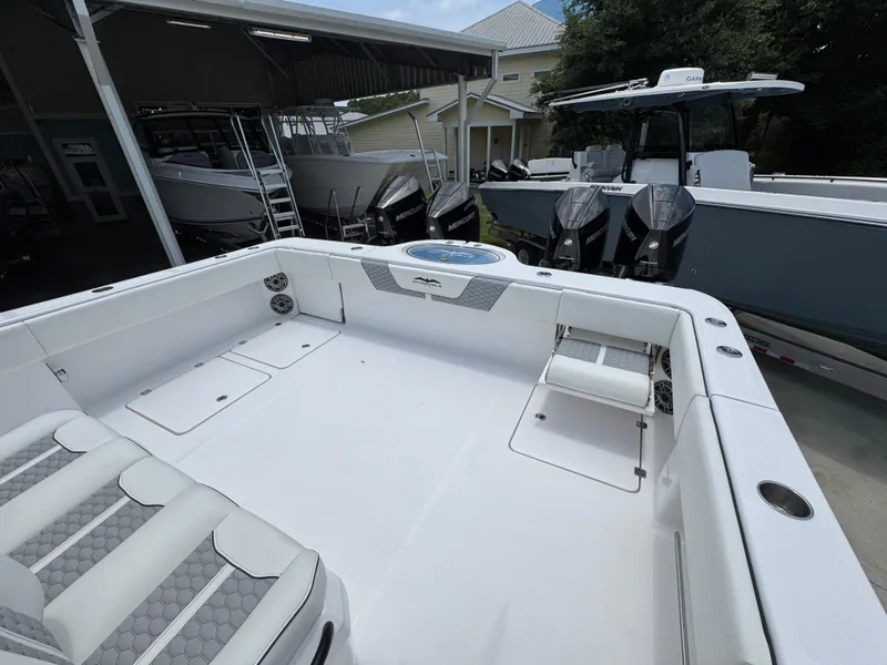 Slide: The Image of 2026 Invincible 36 Catamaran with spacious deck and modern design in a marina setting. - 35