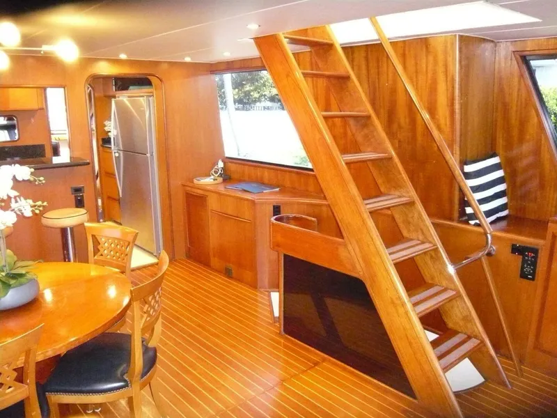 Slide: The Image of Interior of 1990 Viking Cockpit Motor Yacht with wooden decor and modern amenities. - 10
