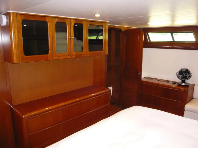 Slide: The Image of Luxurious wood interior of 1990 Viking Cockpit Motor Yacht cabin. - 29