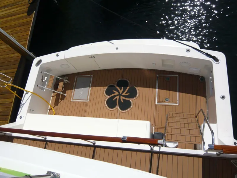 Slide: The Image of Overhead view of 1990 Viking Cockpit Motor Yacht deck with clover design. - 4