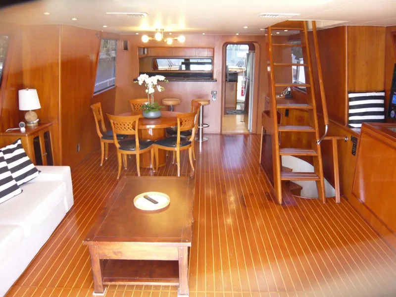 Slide: The Image of Luxurious interior of a 1990 Viking Cockpit Motor Yacht with wooden furnishings and elegant decor. - 6