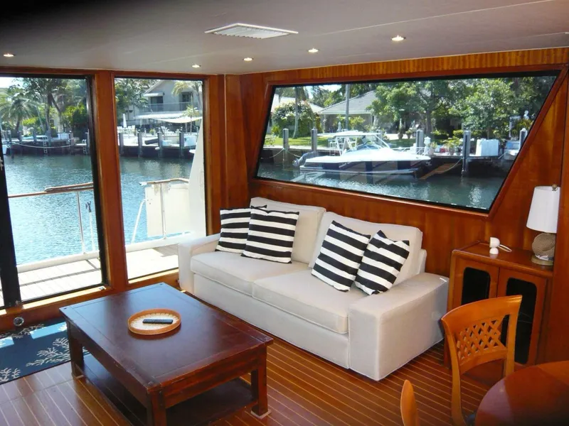 Slide: The Image of Luxurious interior of 1990 Viking Cockpit Motor Yacht with waterfront view and elegant furnishings. - 7