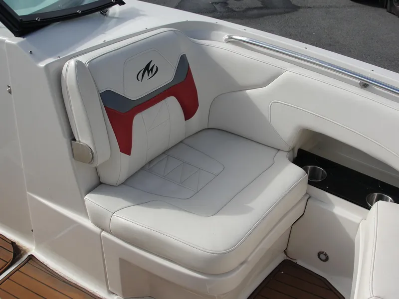 Slide: The Image of White leather seat on 2014 Monterey M5 boat with cup holders. - 12