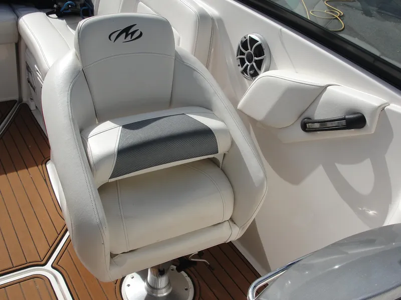 Slide: The Image of White leather seat on 2014 Monterey M5 boat with wood flooring and speaker. - 14