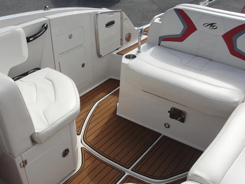 Slide: The Image of Luxurious interior of a 2014 Monterey M5 boat with white seating and wood flooring. - 19