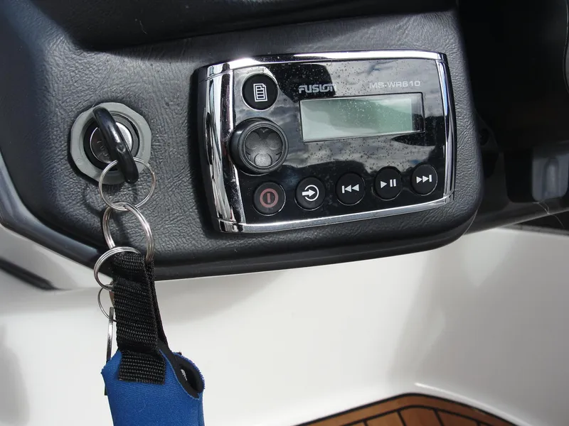Slide: The Image of Boat dashboard with Fusion MS-WR610 stereo and ignition key, Monterey M5 2014 model. - 21