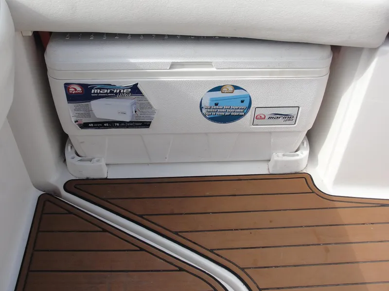 Slide: The Image of Marine cooler on a 2014 Monterey M5 boat with teak-style flooring. - 24