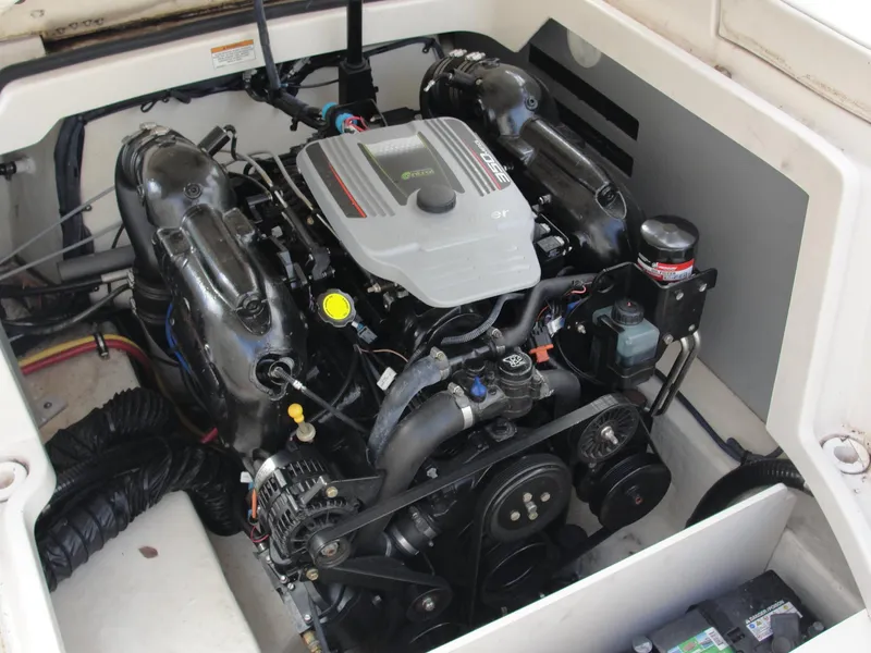 Slide: The Image of Engine compartment of a 2014 Monterey M5 boat, showcasing detailed mechanical components. - 27