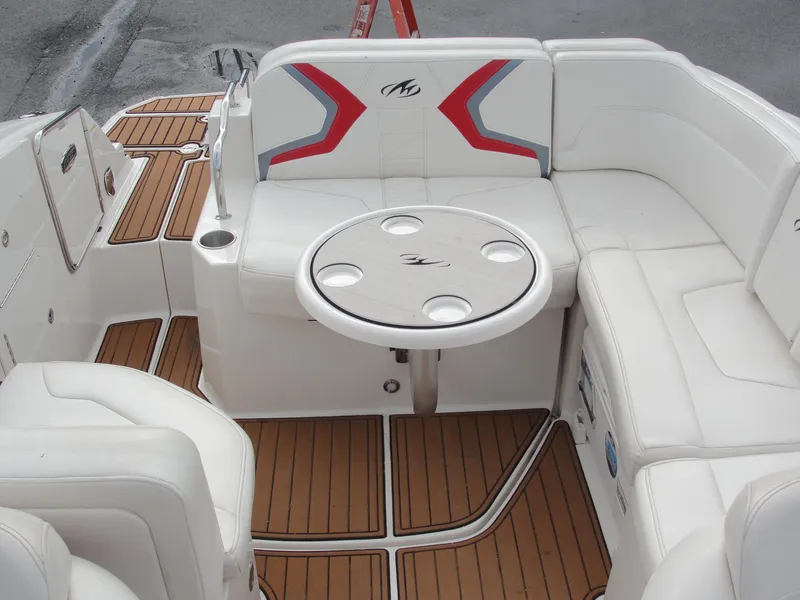 Slide: The Image of Luxurious 2014 Monterey M5 boat interior with white seating and wooden flooring. - 36