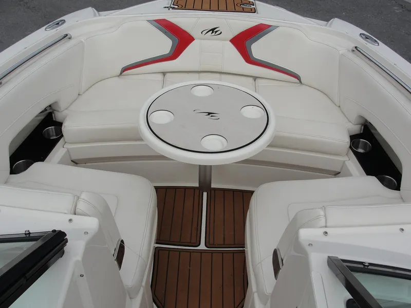 Slide: The Image of Luxurious 2014 Monterey M5 boat interior with white seating and a round table. - 38