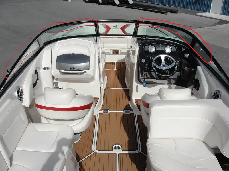 Slide: The Image of Interior of a 2014 Monterey M5 boat with white seating and wood flooring. - 8