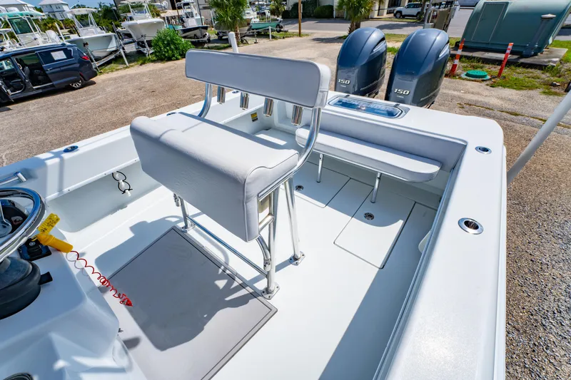 Slide: The Image of 2022 Contender 25T boat interior with dual engines and seating area. - 17
