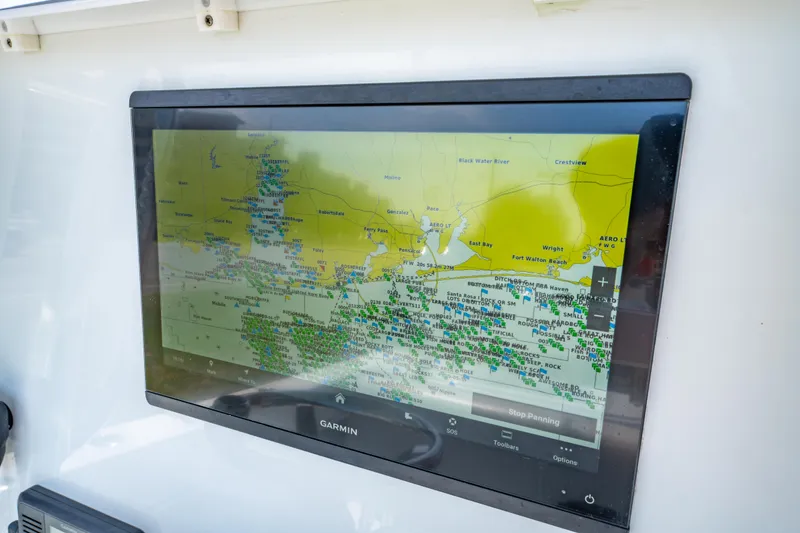 Slide: The Image of Garmin navigation display on 2022 Contender 25T boat, showing detailed marine map. - 26
