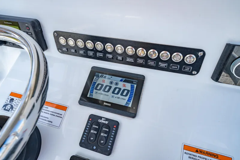 Slide: The Image of Dashboard of a 2022 Contender 25T boat with Yamaha display and control panel. - 27