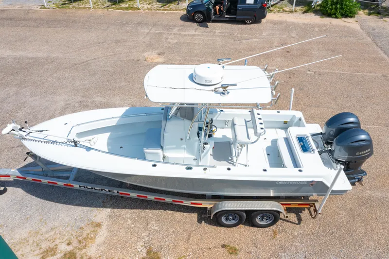 Slide: The Image of 2022 Contender 25T boat on trailer with dual Yamaha engines, aerial view. - 3
