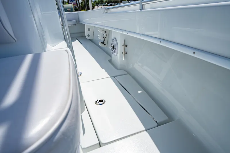Slide: The Image of 2022 Contender 25T boat interior with sleek white deck and seating. - 34