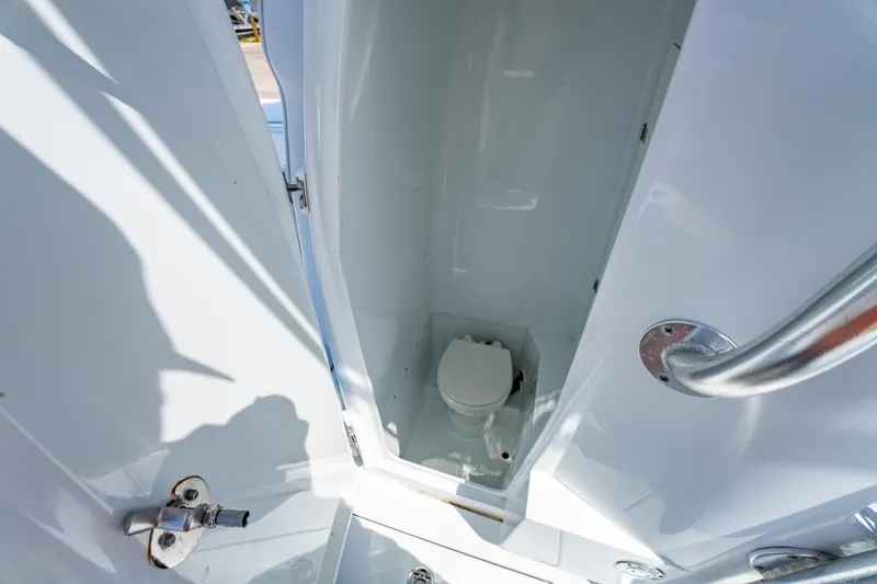 Slide: The Image of 2022 Contender 25T boat interior with compact marine toilet. - 35