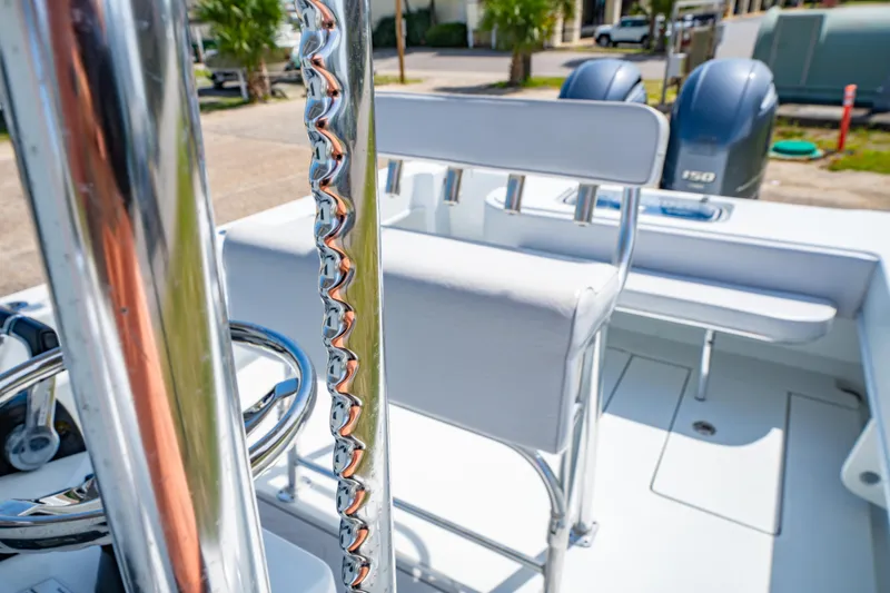 Slide: The Image of 2022 Contender 25T boat interior with chrome details and dual engines. - 36