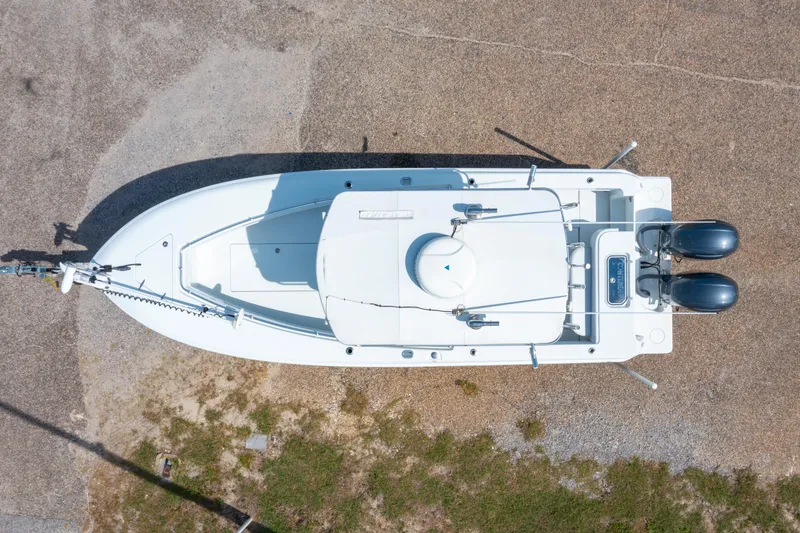 Slide: The Image of Overhead view of a 2022 Contender 25T boat with dual engines on a trailer. - 4