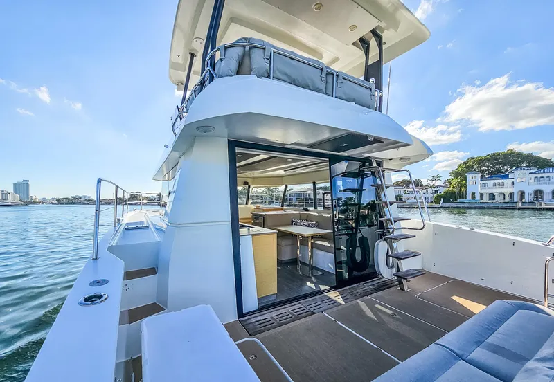 Slide: The Image of 2017 Fountaine Pajot MY 37 yacht with open deck and luxurious interior on a sunny day. - 18