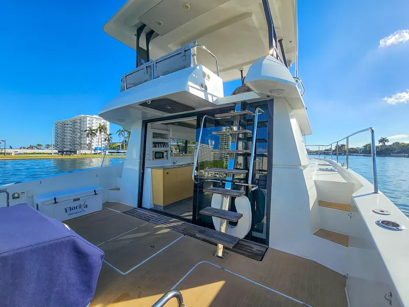 Slide: The Image of 2017 Fountaine Pajot MY 37 yacht with modern design, docked by waterfront buildings. - 20