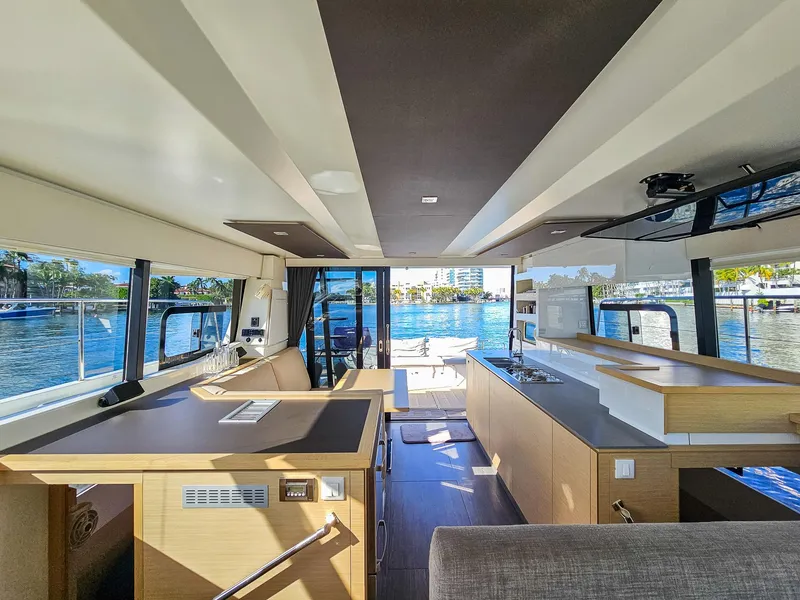 Slide: The Image of Interior of 2017 Fountaine Pajot MY 37 yacht with modern design and waterfront view. - 25