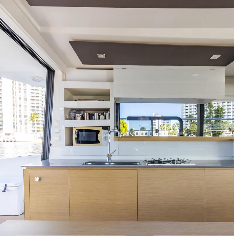 Slide: The Image of Modern kitchen interior on 2017 Fountaine Pajot MY 37 yacht, featuring sleek cabinetry and appliances. - 32