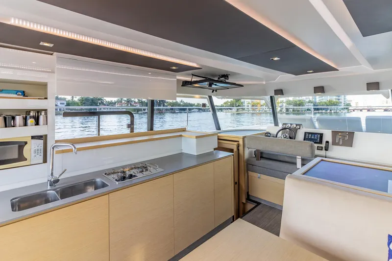 Slide: The Image of Modern interior of 2017 Fountaine Pajot MY 37 yacht with kitchen and helm. - 34