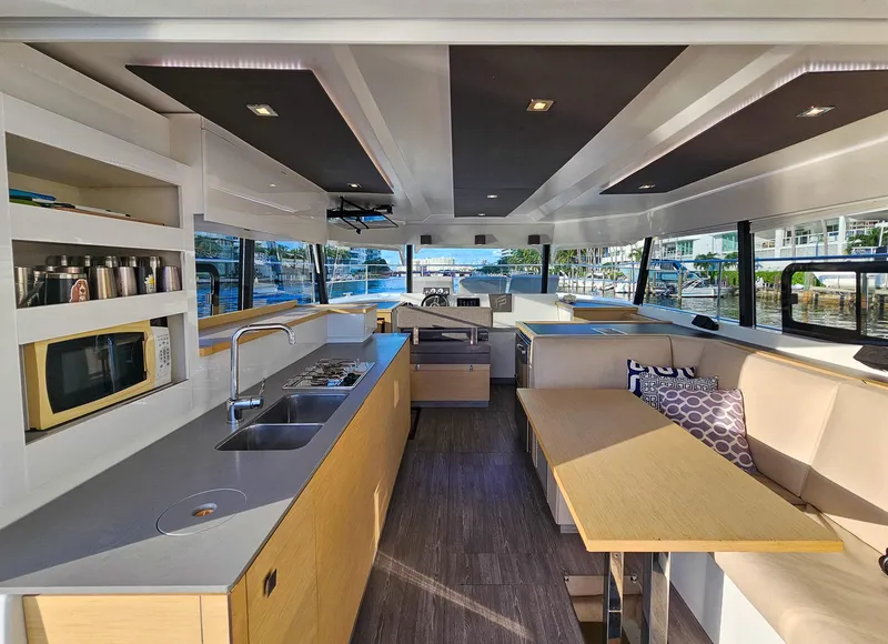 Slide: The Image of Luxurious interior of 2017 Fountaine Pajot MY 37 yacht with modern kitchen and seating area. - 35