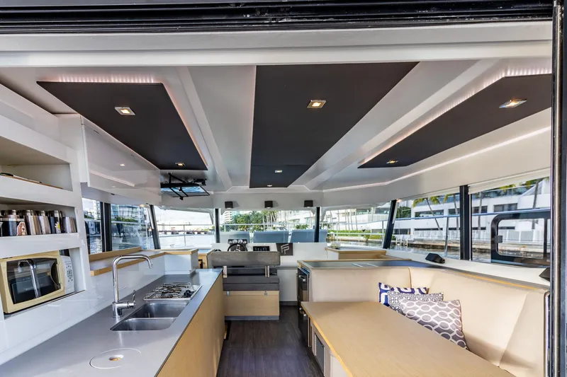 Slide: The Image of Luxurious interior of 2017 Fountaine Pajot MY 37 yacht with modern kitchen and seating area. - 36