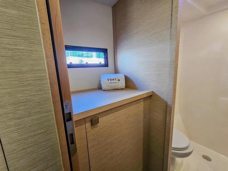Slide: The Image of Bathroom interior of 2017 Fountaine Pajot MY 37 yacht with window and storage. - 38