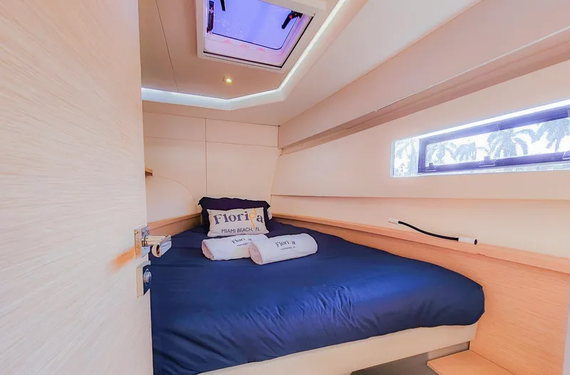 Slide: The Image of Cozy cabin interior of 2017 Fountaine Pajot MY 37 yacht with blue bedding. - 46