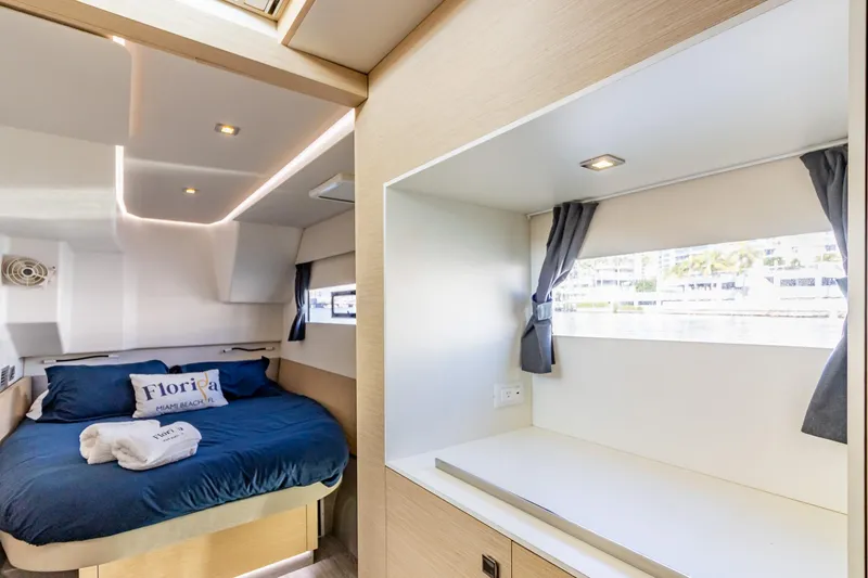 Slide: The Image of Luxurious cabin interior of 2017 Fountaine Pajot MY 37 yacht with cozy bed and window view. - 47
