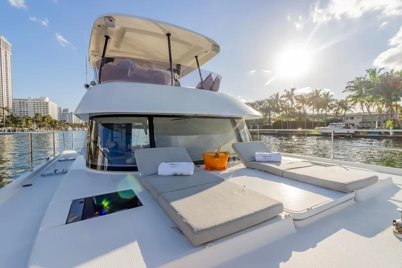 Slide: The Image of Luxurious 2017 Fountaine Pajot MY 37 yacht with sun loungers, cruising in sunny waters. - 17