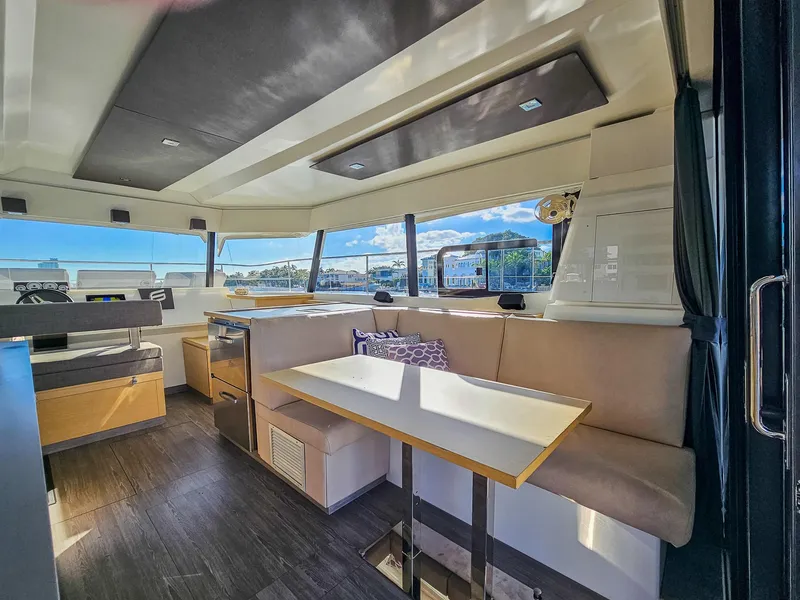 Slide: The Image of Interior of 2017 Fountaine Pajot MY 37 yacht with modern seating and panoramic windows. - 29