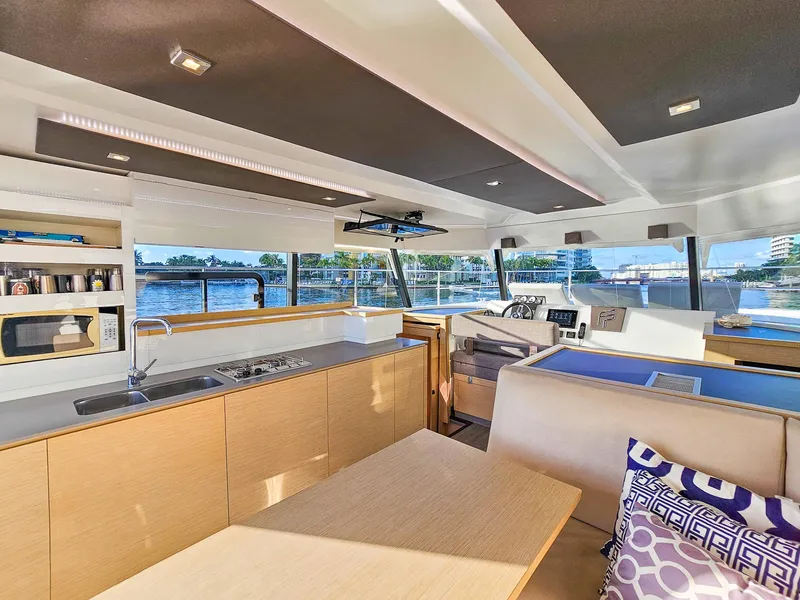 Slide: The Image of Luxurious interior of 2017 Fountaine Pajot MY 37 yacht with modern kitchen and seating area. - 31