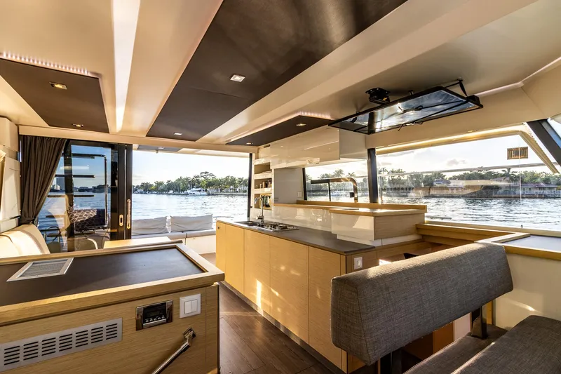 Slide: The Image of Luxurious interior of 2017 Fountaine Pajot MY 37 yacht with modern kitchen and scenic water view. - 33