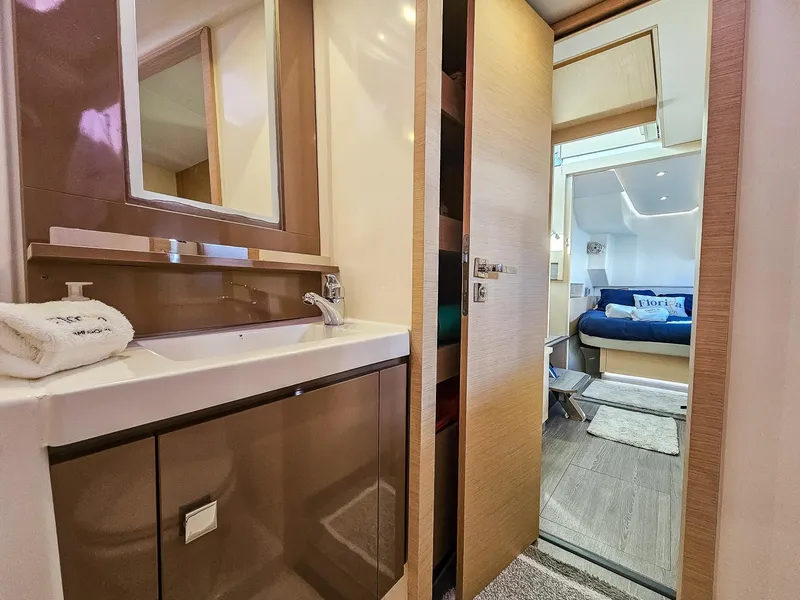 Slide: The Image of Luxurious interior of 2017 Fountaine Pajot MY 37 yacht, featuring a modern bathroom and cozy bedroom. - 39