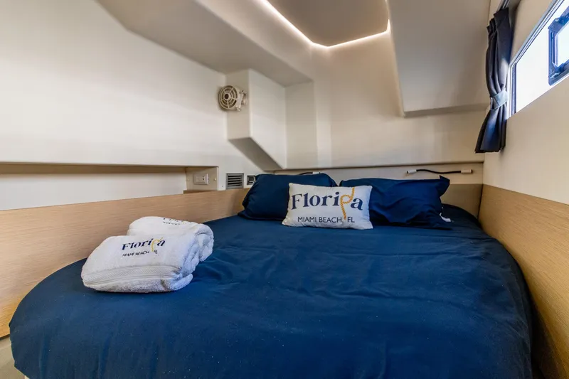 Slide: The Image of Cozy cabin interior of 2017 Fountaine Pajot MY 37 with navy bedding and Florida-themed decor. - 44