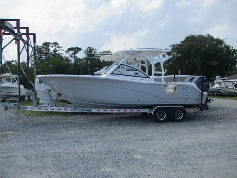 Slide: The Image of 2023 Sea Fox 268 Traveler boat on trailer, parked outdoors. - 0
