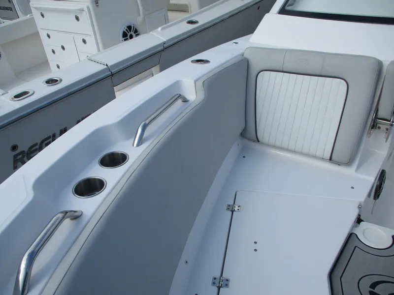 Slide: The Image of 2023 Sea Fox 268 Traveler boat interior with cup holders and cushioned seating. - 10