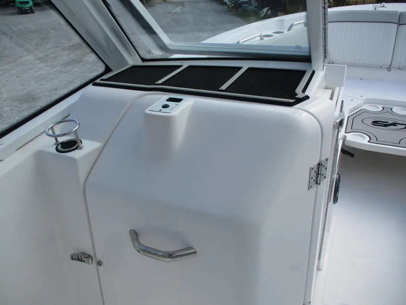Slide: The Image of 2023 Sea Fox 268 Traveler boat interior with cup holder and storage compartment. - 13
