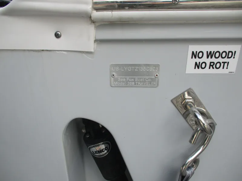 Slide: The Image of 2023 Sea Fox 268 Traveler boat detail with "No Wood! No Rot!" sticker and metal chain. - 16