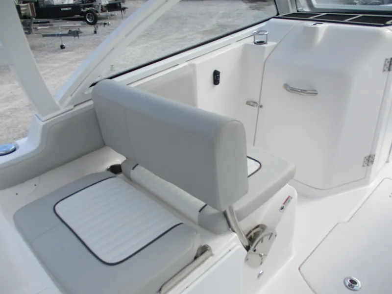 Slide: The Image of 2023 Sea Fox 268 Traveler boat interior with cushioned seating and storage compartment. - 6