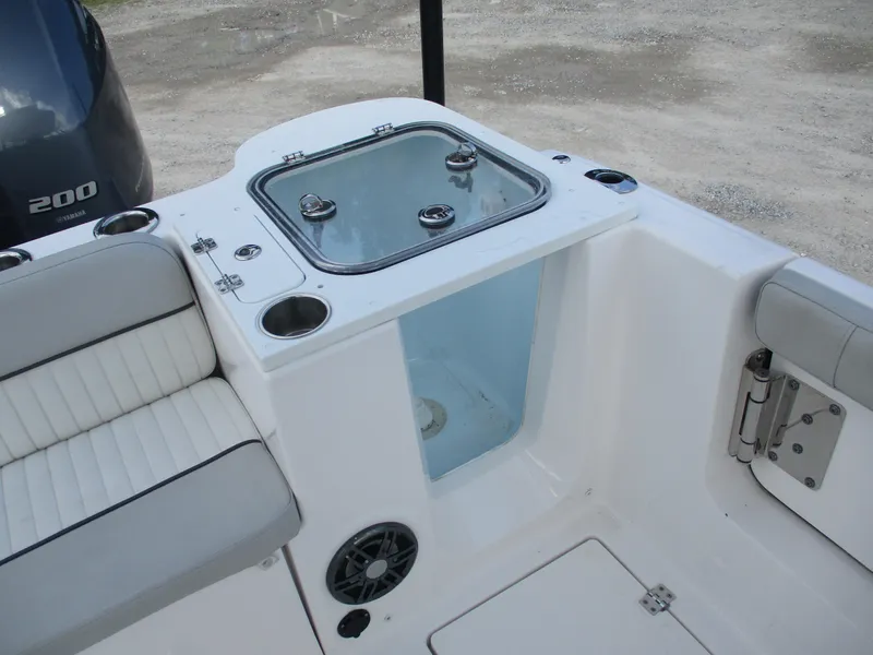 Slide: The Image of 2023 Sea Fox 268 Traveler boat interior with seating, storage, and Yamaha 200 engine. - 8