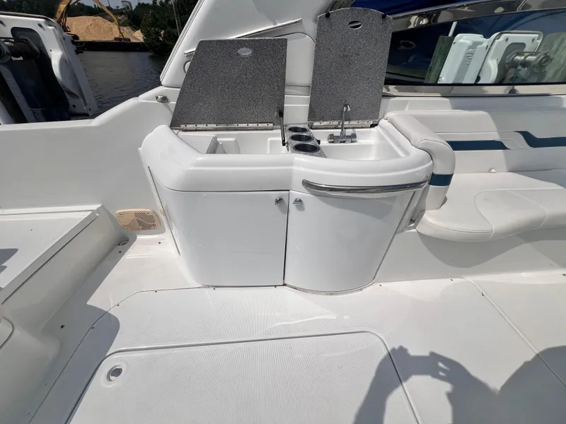 Slide: The Image of 2005 Formula 330 Sun Sport boat interior with sink and storage area. - 11